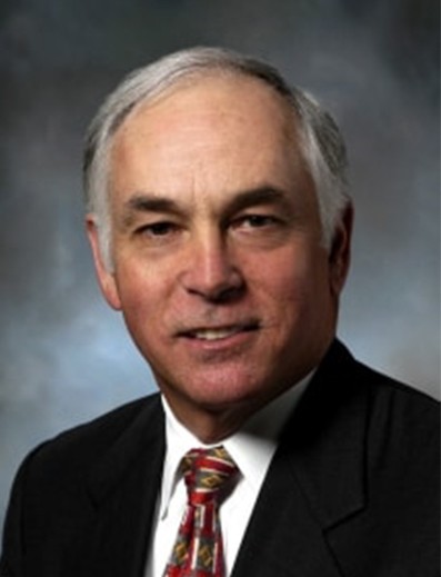 Male employee smiles for camera